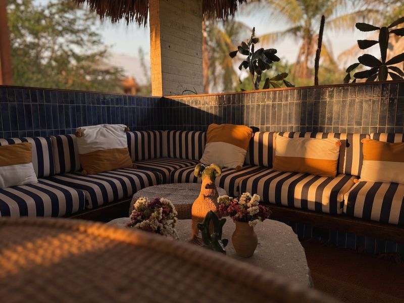 Striped sofa against blue tiles