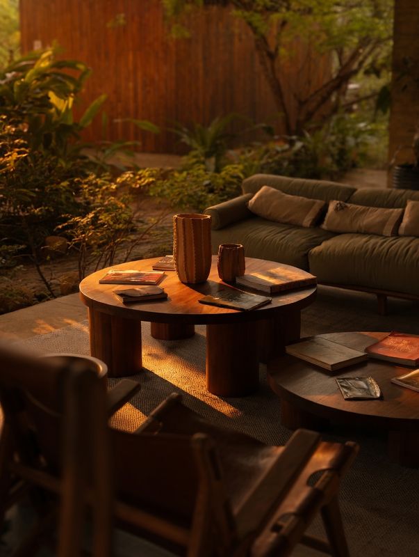 Ceramics and books on the lounge tables, last light