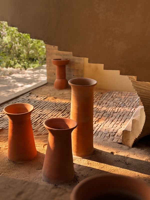 Terracotta vessels beneath the staircase