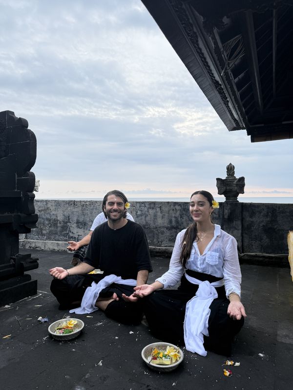 Morning offering at a temple rooftop in Bali
