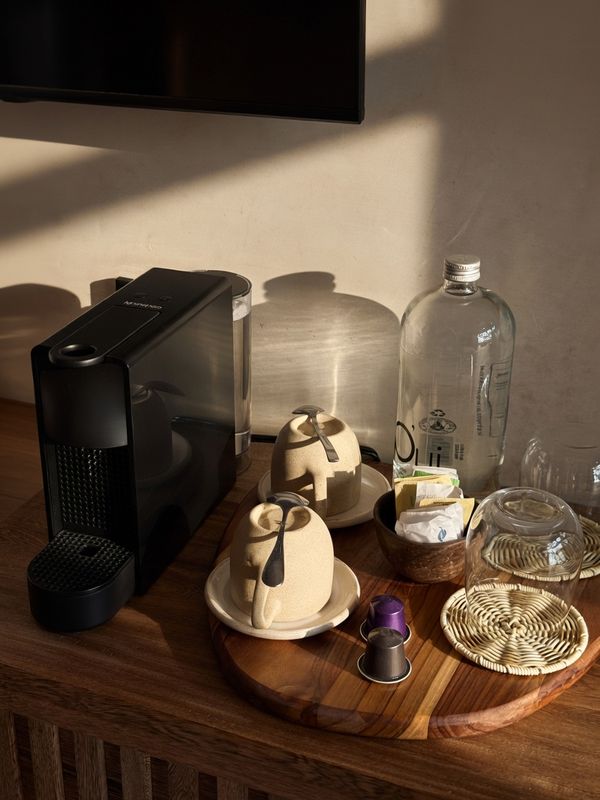 Coffee set and woven coasters on the desk